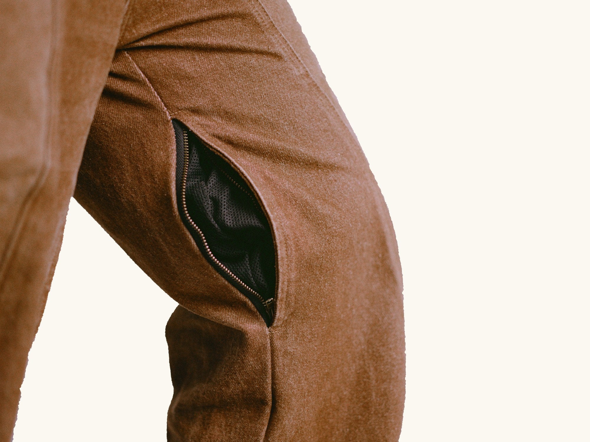 Zip-up mesh thigh vent shown open at the knee